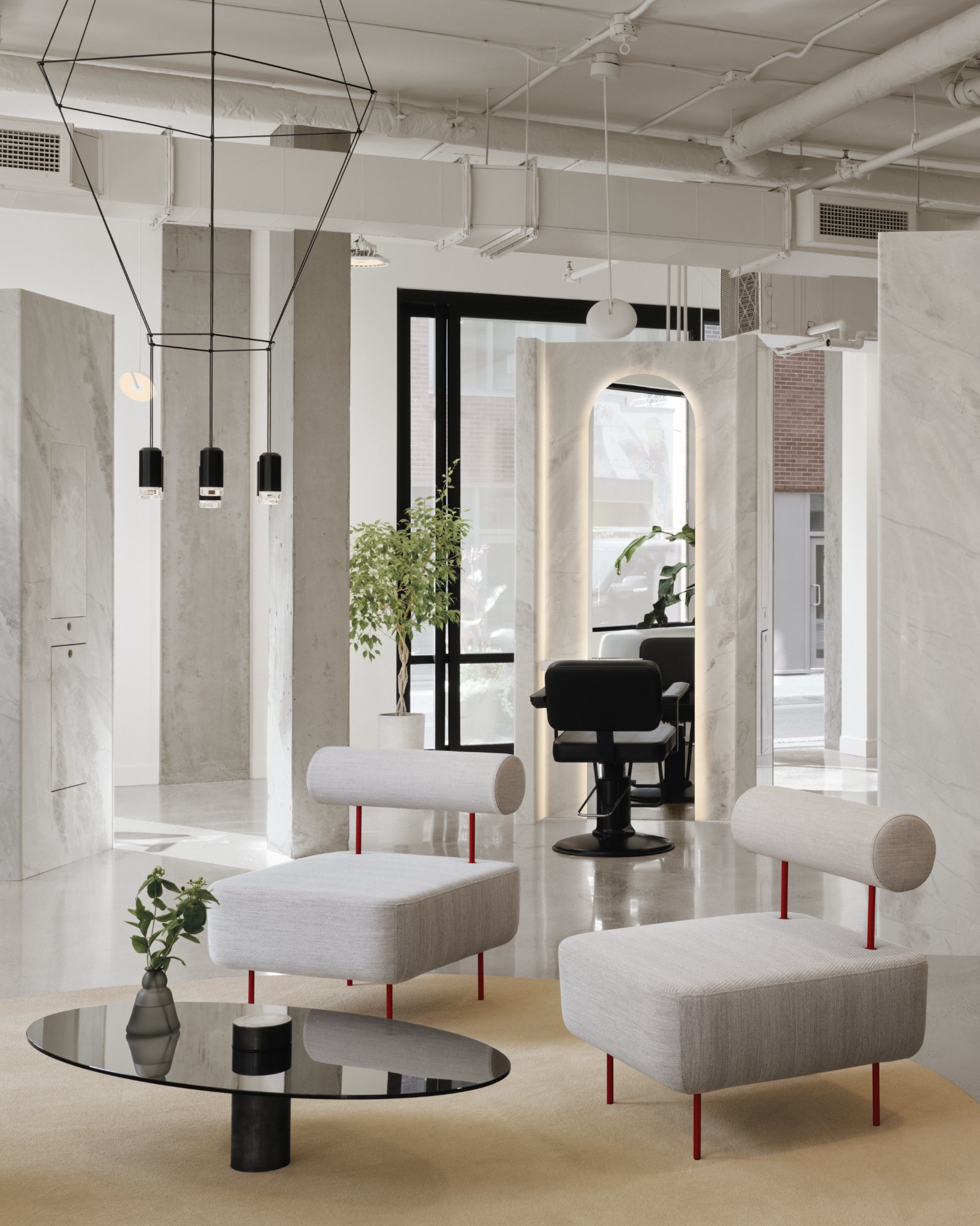 Artemys Salon — Brass-accented tables in space