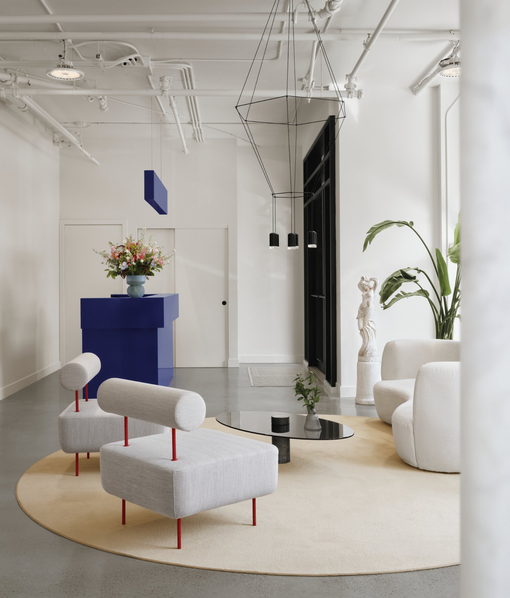Artemys Salon — Reception area with powder-coated steel desk
