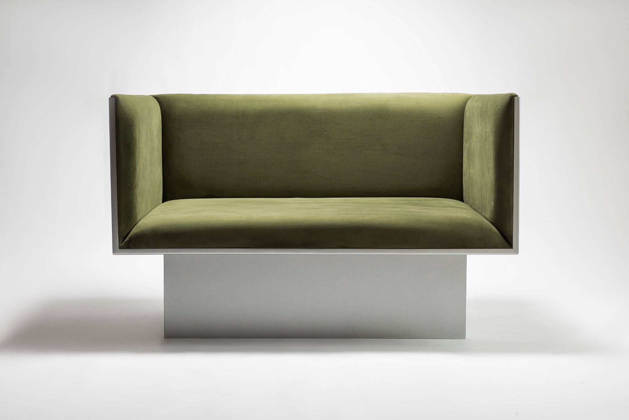 Old Port Collection — Green velvet sofa on brushed steel pedestal